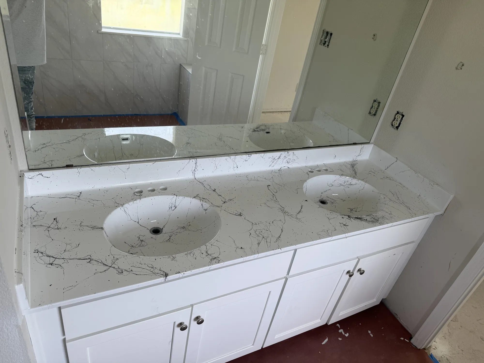 Countertop refinished with a veined marble-look finish