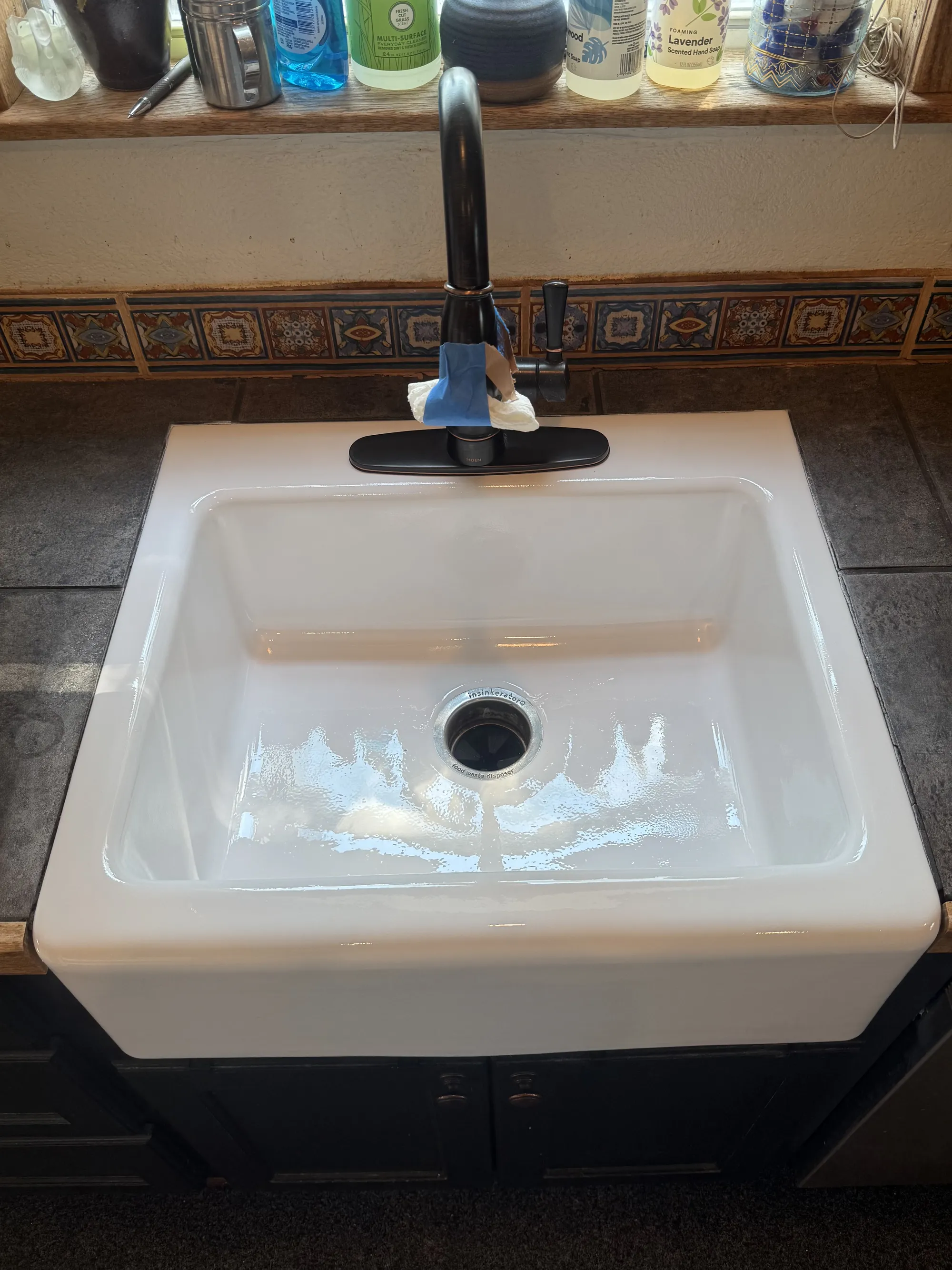 The farmhouse sink refinished to bright white