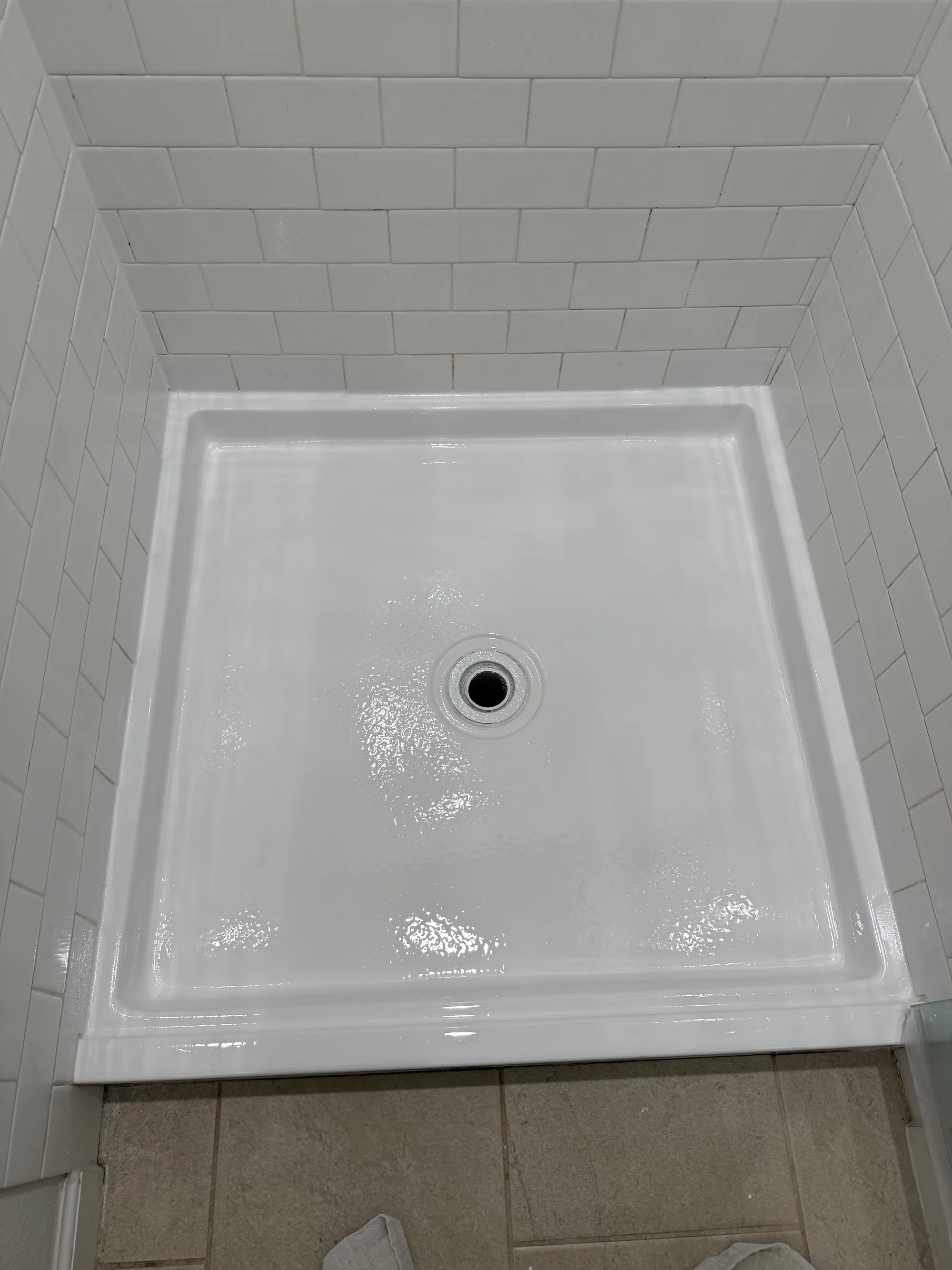 The shower pan repaired to a smooth finish