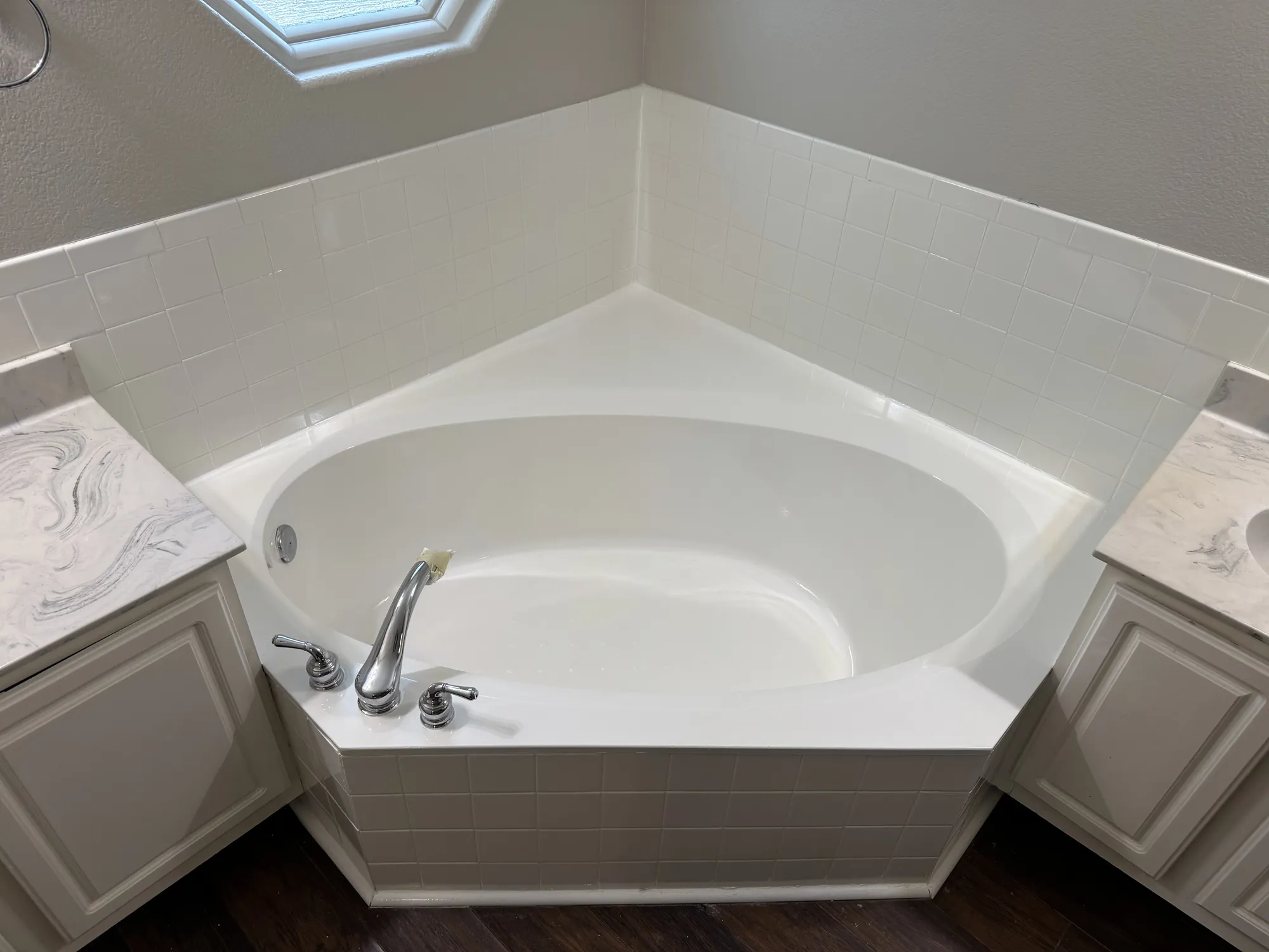 The corner tub refinished and finished